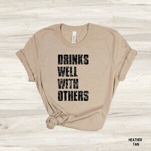 NWT Bella Canvas Unisex Graphic Tee Pour Drinks Well With Others Tan 3XL